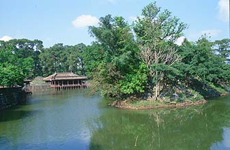 Hue - Royal Tombs lotus pond with building