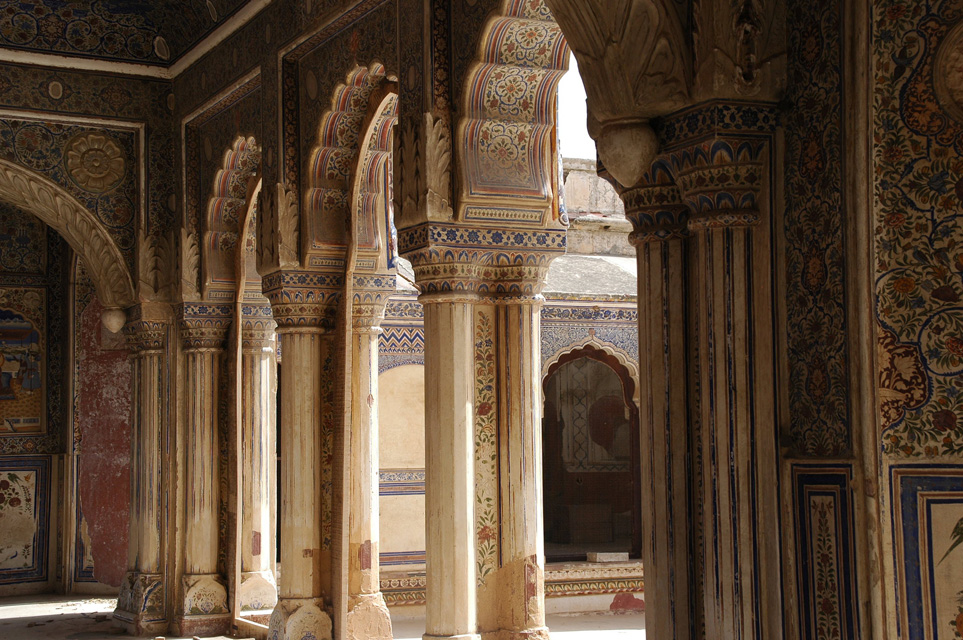 JAI Karauli in Rajasthan - City Palace colourful frescoes on pillars and archways 3008x2000