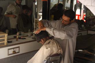 JAI Karauli in Rajasthan - boys having a haircut in a barber shop 3008x2000