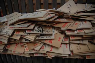 KIX Nara - small shrine Votive plaques or ema made of wood where visitors can write a wish 01 3008x2000