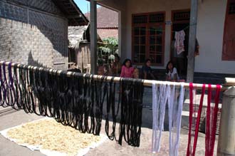 AMI Lombok Pringgasela traditional weaving village dyed threads drying in the sun 3008x2000