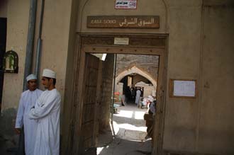 MCT Nizwa - east souq market entrance gate with men in traditional dress 3008x2000