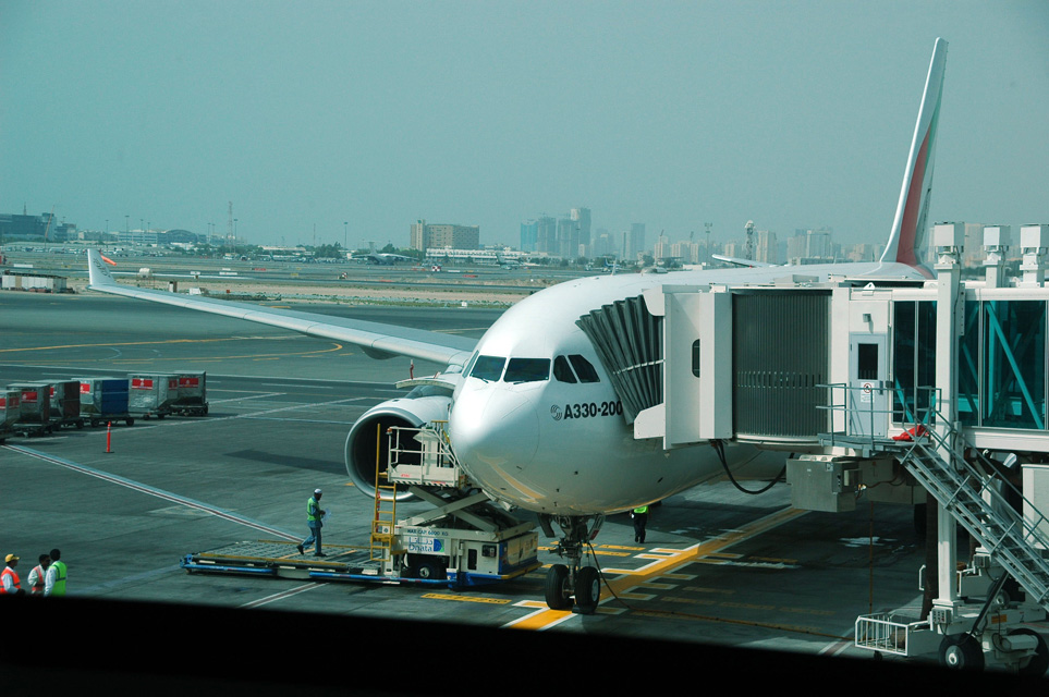 DXB Dubai International Airport - Emirates Airlines Airbus A330-200 aircraft at the gate in Terminal 1 3008x2000