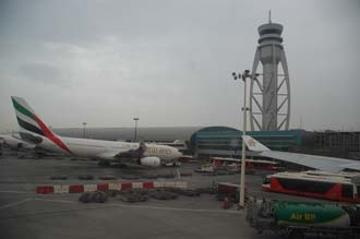 DXB Dubai International Airport - Terminal 1 with Tower and aircrafts at the gates 02 3008x2000