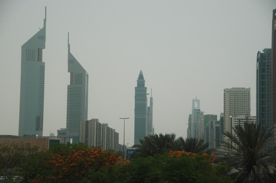 DXB Dubai Jumeirah Beach - Sheikh Zayed Road skyscrapers with flowers and palms 0143008x2000