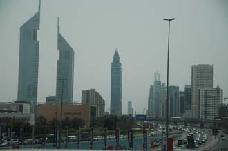 DXB Dubai Jumeirah Beach - Sheikh Zayed Road with the Emirates Towers and The Tower skyscrapers 0133008x2000